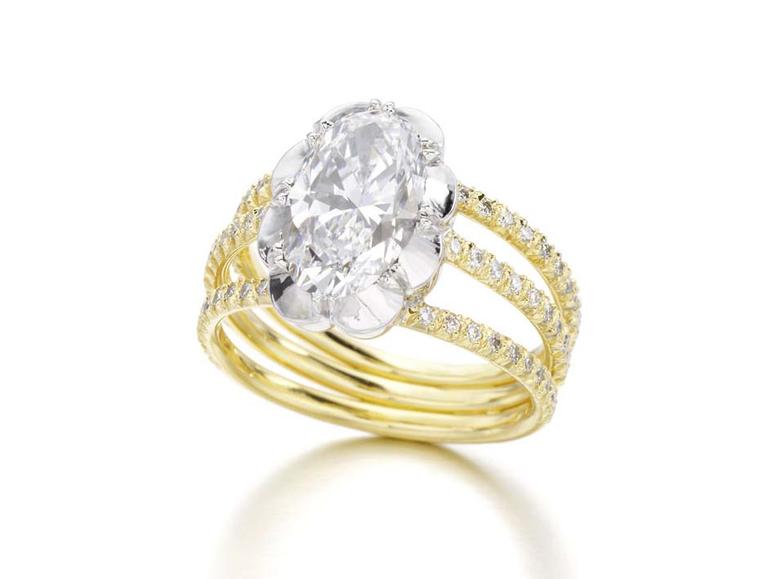 Jessica McCormack Oval Diamond Trio engagement ring in yellow gold set with a 2.24ct oval-cut diamond mounted in a Georgian-style cut.